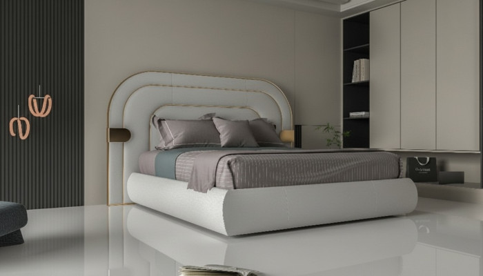 Cadru de pat gri luxos cu detalii aurii în design modern și capitonaj moale
